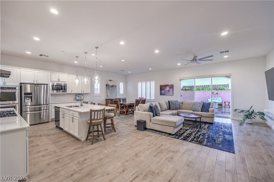 Great Room with Ceiling Fan, Recessed Lighting, Tile Flooring, and Floor Outlet