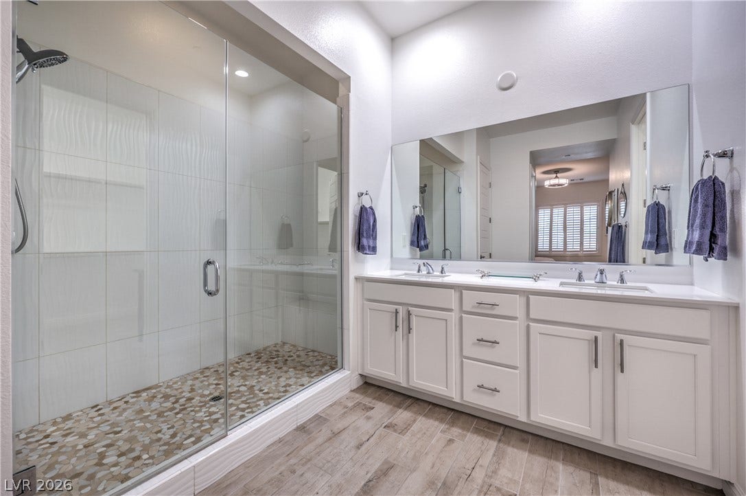 Owner's Bathroom with Dual Sinks, Raised Vanity, Oversized Walk-In Shower, Linen Closet, and Comfort Height Toilet