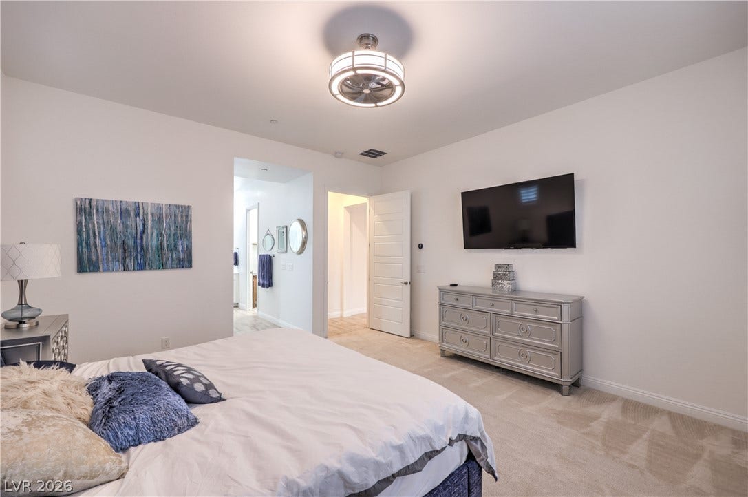 Owner's Suite features a Ceiling Fan, Walk-In Closet and Bathroom with Dual Sinks, Raised Vanity, Oversized Walk-In Shower, Linen Closet, and Comfort Height Toilet