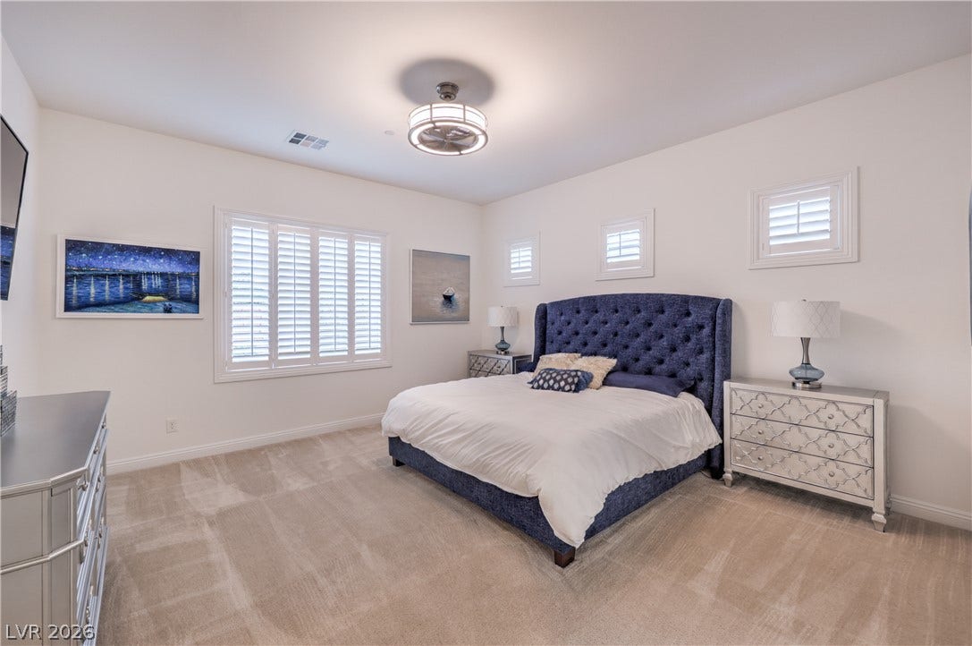 Owner's Suite features a Ceiling Fan, Walk-In Closet and Bathroom with Dual Sinks, Raised Vanity, Oversized Walk-In Shower, Linen Closet, and Comfort Height Toilet