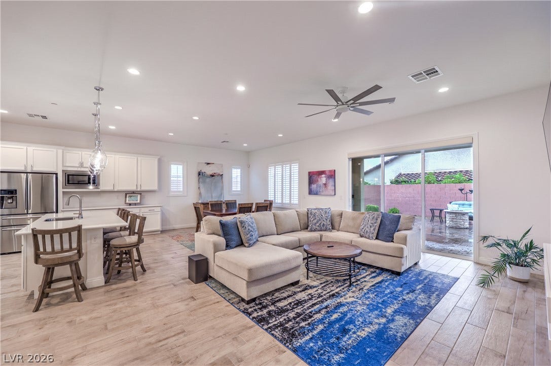 Great Room with Ceiling Fan, Recessed Lighting, Tile Flooring, and Floor Outlet