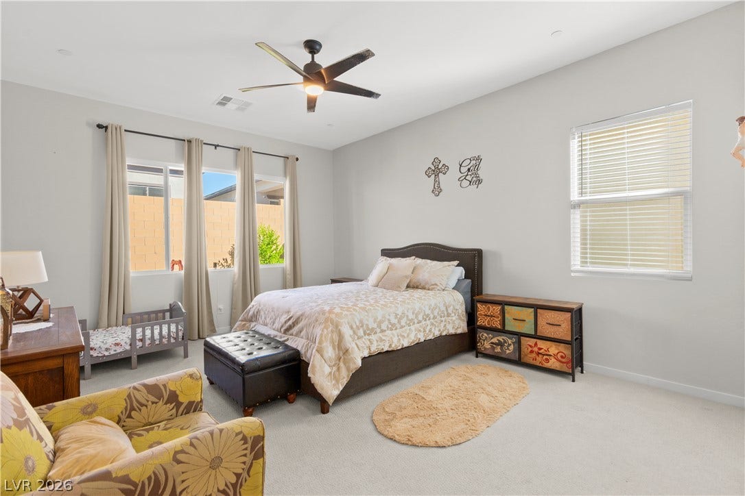 848 Purser Street, Henderson, NV 89011 Generous windows fill this serene bedroom with abundant natural light.