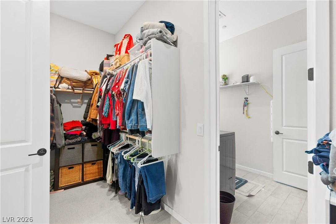 848 Purser Street, Henderson, NV 89011 A spacious walk-in closet with built-in organizer shelving sits adjacent to the laundry room.