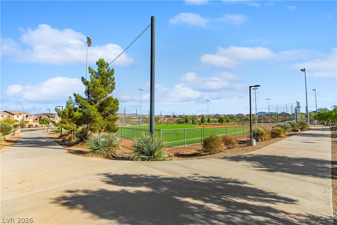 848 Purser Street, Henderson, NV 89011 Concrete walking paths wind past community sports fields under a bright, open desert sky.