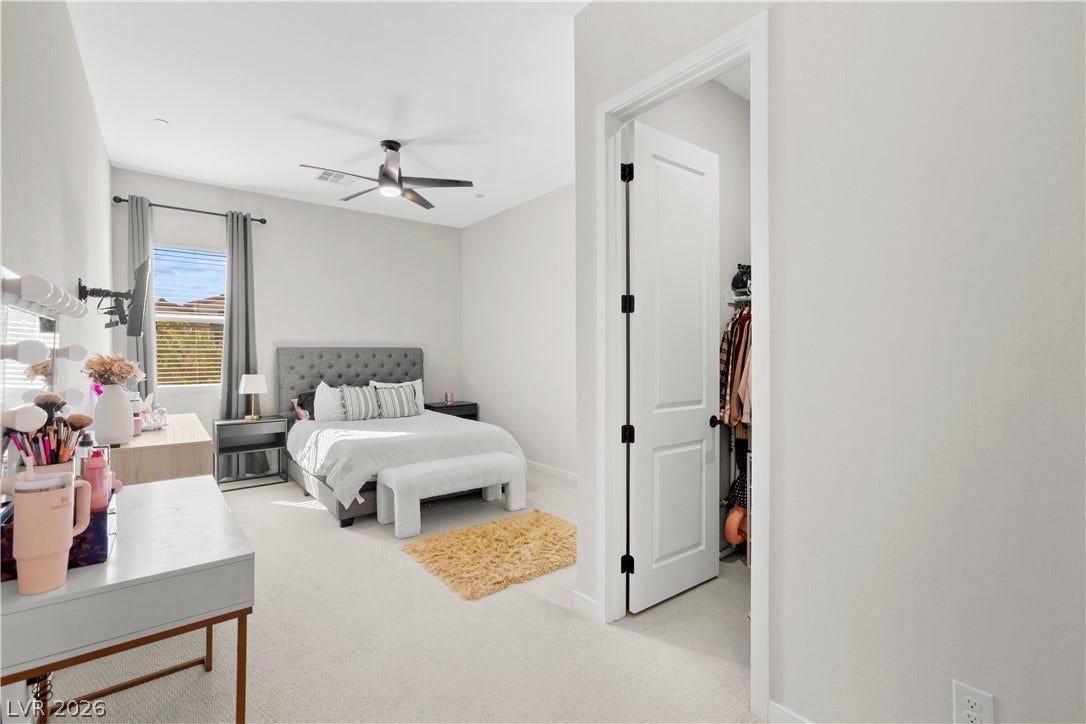 848 Purser Street, Henderson, NV 89011 Plush carpeting and an adjacent walk-in closet enhance this comfortable bedroom retreat.