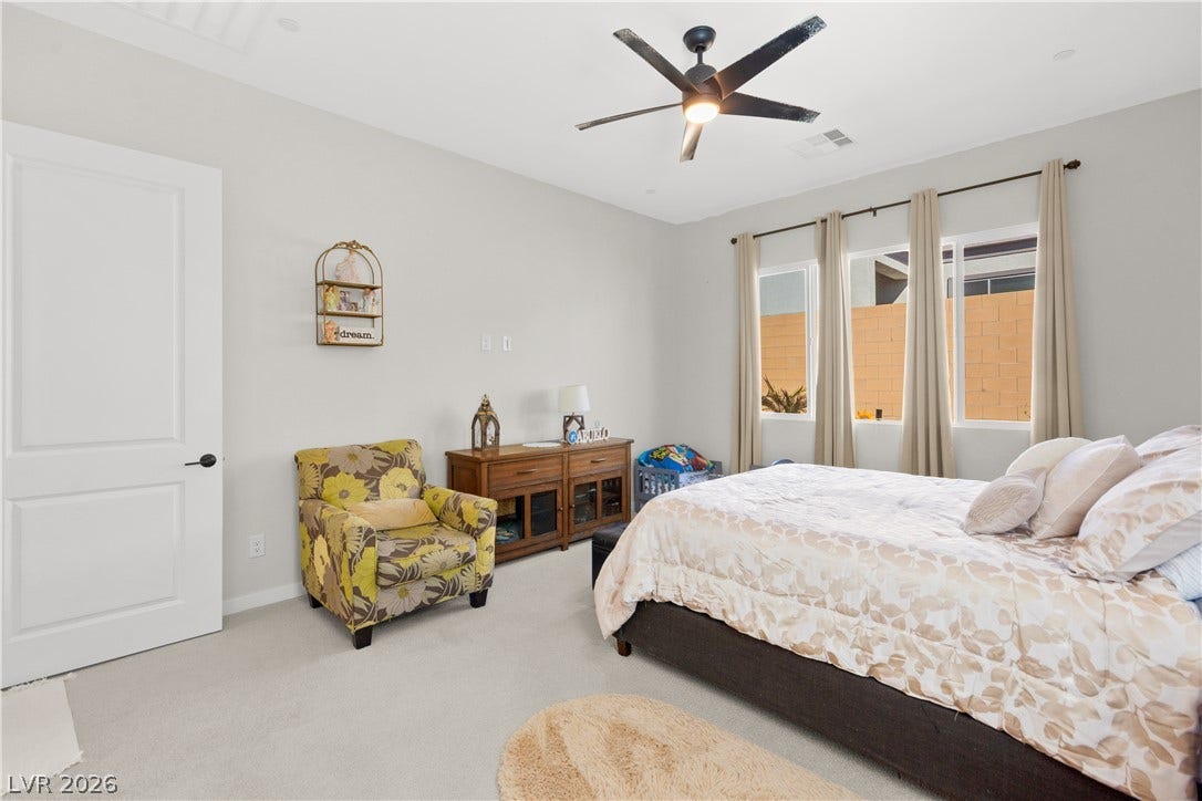 848 Purser Street, Henderson, NV 89011 Plush carpeted flooring and abundant natural light define this comfortable private retreat.