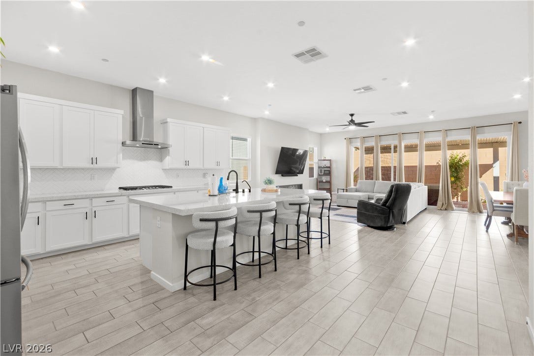 848 Purser Street, Henderson, NV 89011 Clean lines and light flooring define this airy open-concept kitchen and living area.