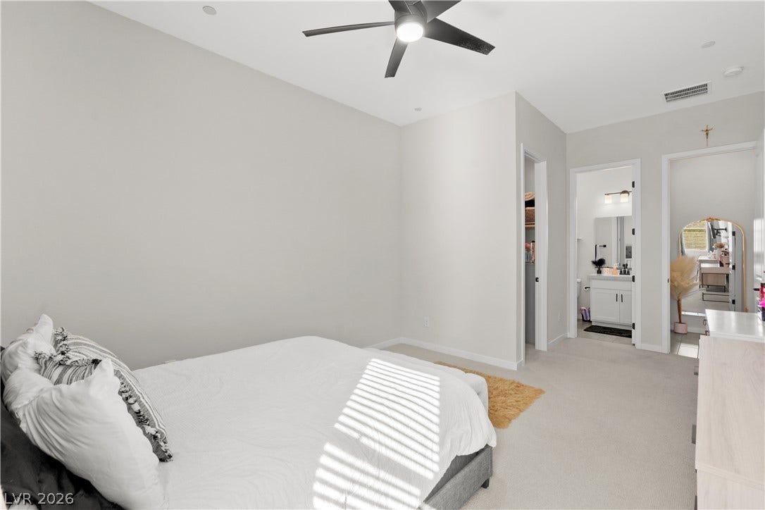 848 Purser Street, Henderson, NV 89011 Smooth plaster walls and soft carpeting define this serene private sanctuary.