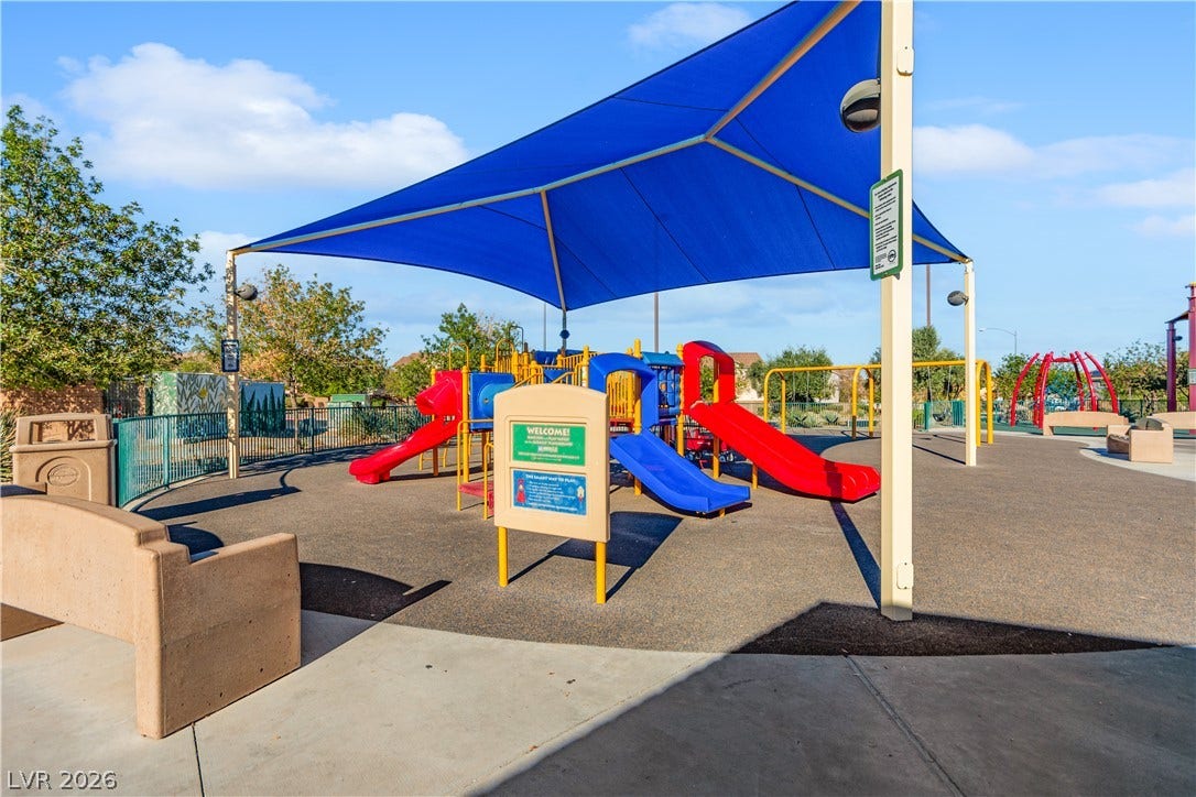 848 Purser Street, Henderson, NV 89011 A shaded playground area provides a colorful neighborhood space under sunny skies.