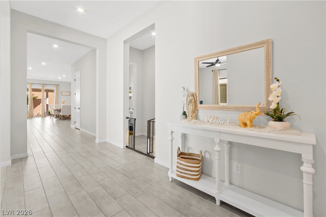 848 Purser Street, Henderson, NV 89011 Polished tile flooring guides guests through a wide foyer toward an open layout.