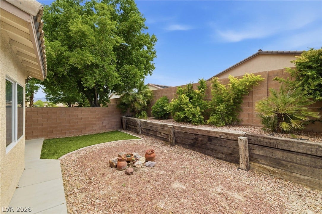 4911 S Castello Way, Pahrump, NV 89061 Terraced planter beds and low-maintenance landscaping create a peaceful outdoor retreat.