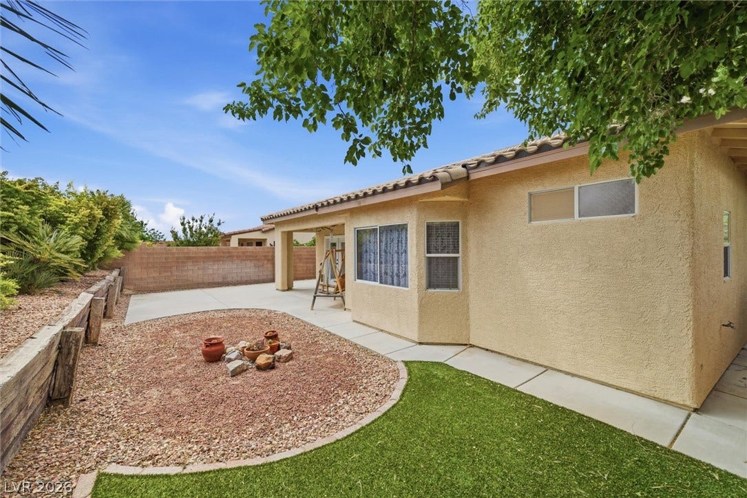 4911 S Castello Way, Pahrump, NV 89061 Stucco exterior and low-maintenance landscaping define this inviting backyard space.
