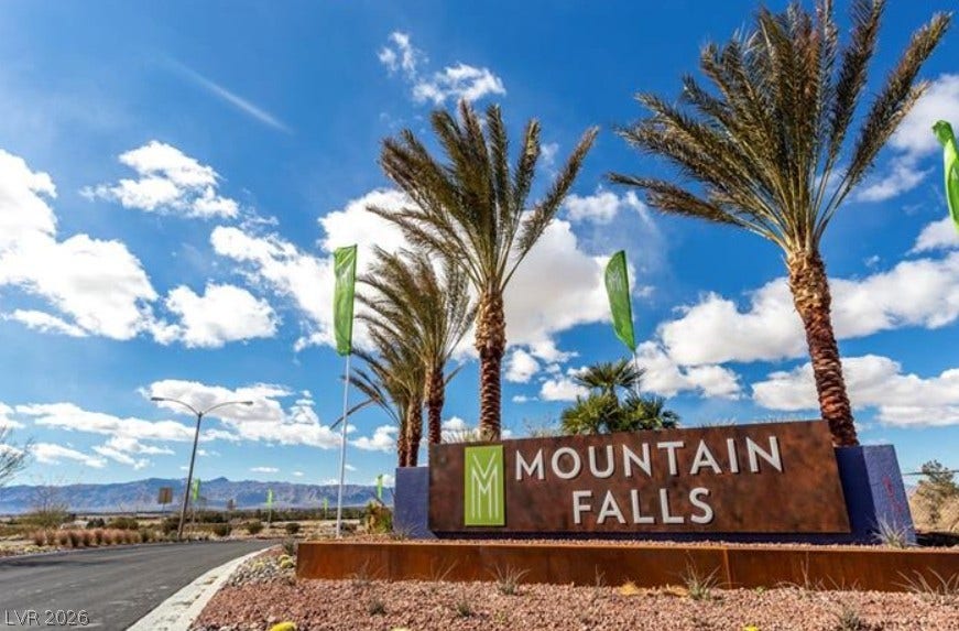 4911 S Castello Way, Pahrump, NV 89061 Palm trees frame the entrance signage welcoming residents under desert skies.