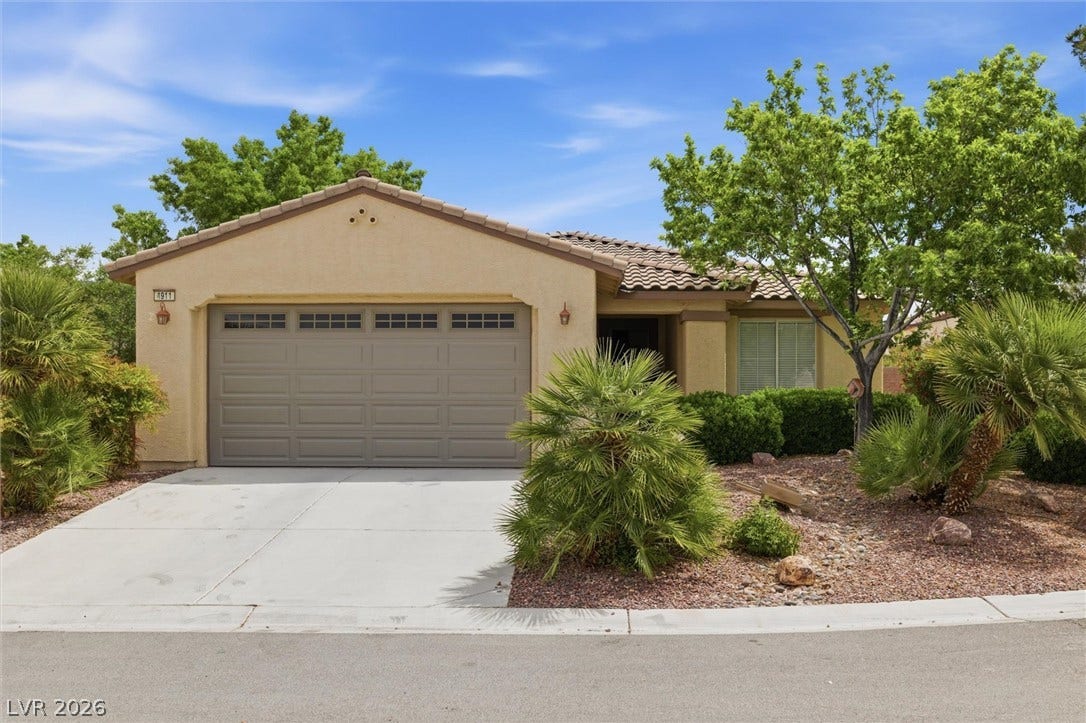 4911 S Castello Way, Pahrump, NV 89061 Desert landscaping and a tiled roof enhance the curb appeal of this classic stucco exterior.