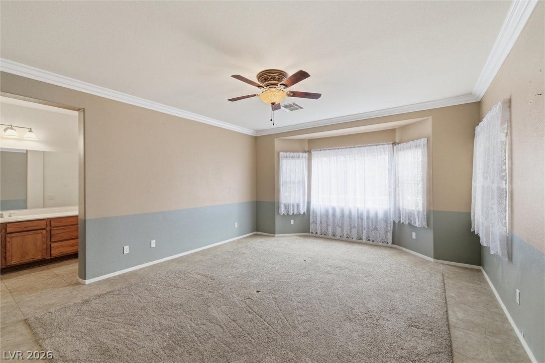 4911 S Castello Way, Pahrump, NV 89061 Plentiful natural light streams through a classic bay window into this spacious bedroom.