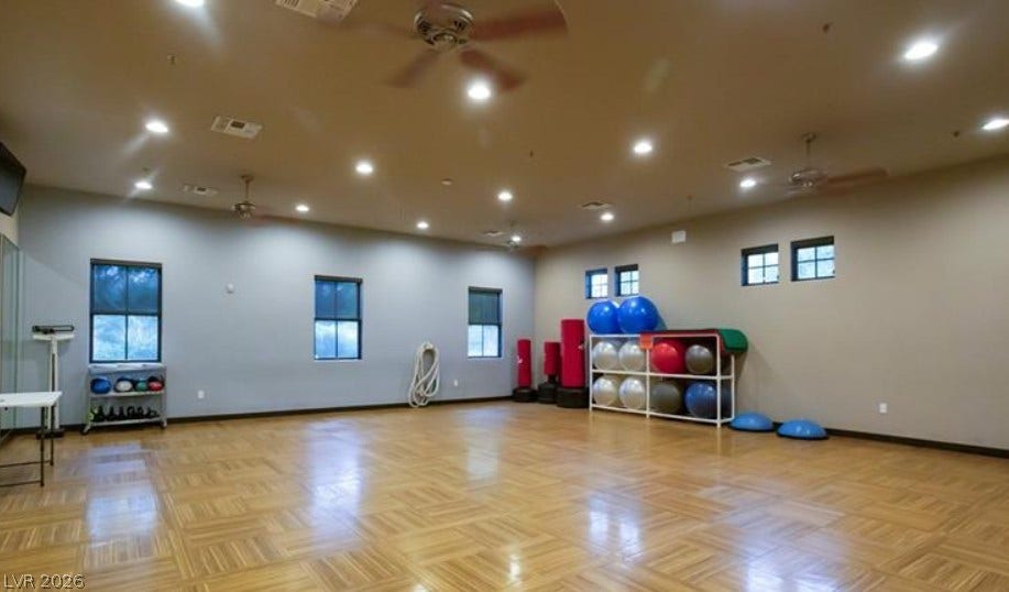 4911 S Castello Way, Pahrump, NV 89061 Gleaming parquet floors and abundant recessed lighting define this spacious fitness studio.