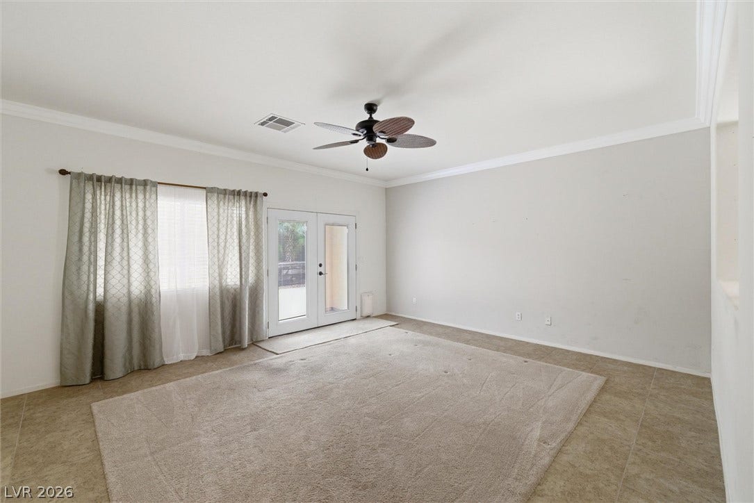 4911 S Castello Way, Pahrump, NV 89061 Double doors open to the outdoors from this versatile space featuring neutral tile flooring.