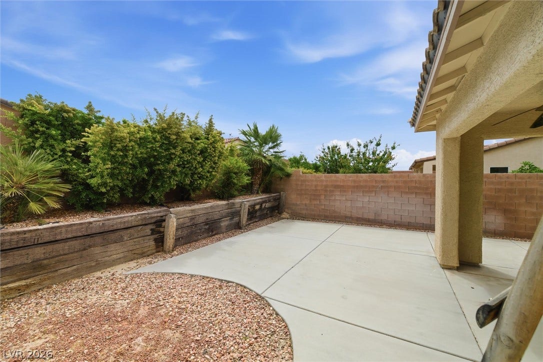 4911 S Castello Way, Pahrump, NV 89061 A spacious concrete patio overlooks a low-maintenance yard bordered by a sturdy block wall.