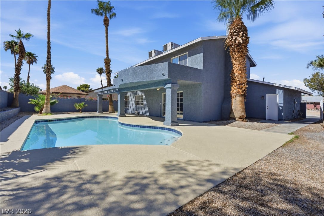 1707 Mapleton Lane, Las Vegas, NV 89119 An inviting private pool and covered patio highlight this desert-landscaped backyard retreat.