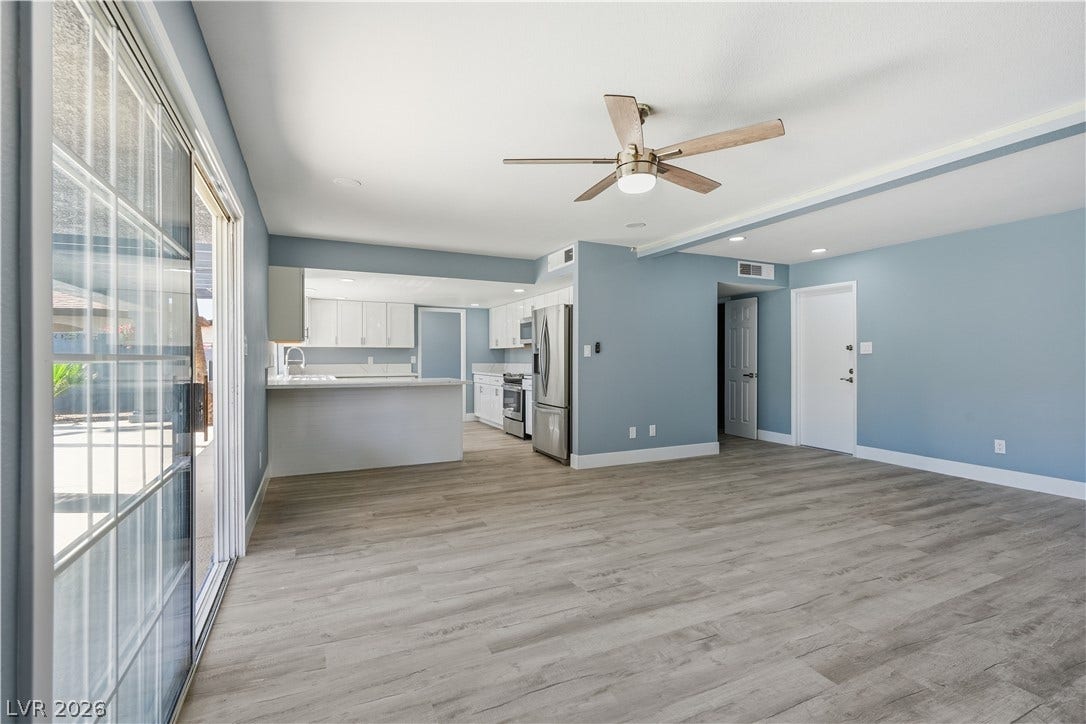 1707 Mapleton Lane, Las Vegas, NV 89119 Sliding glass doors open from the living area directly to the outdoor patio.