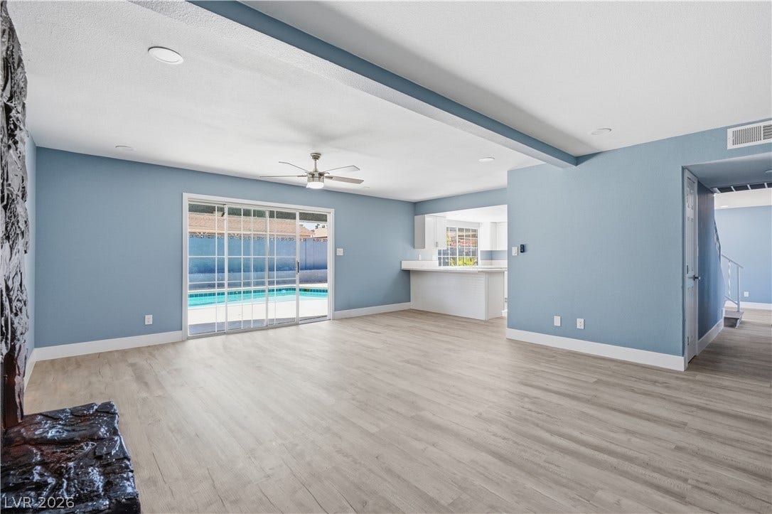 1707 Mapleton Lane, Las Vegas, NV 89119 A spacious layout connects the living areas, highlighted by durable flooring and backyard sliding doors.