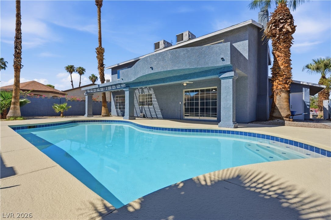 1707 Mapleton Lane, Las Vegas, NV 89119 A private swimming pool and covered concrete patio define this backyard setting.