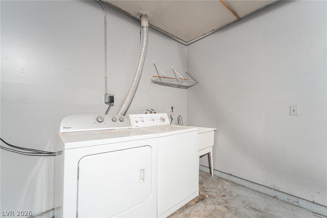 768 Panhandle Drive, Henderson, NV 89014 Functional basement laundry area features concrete flooring and a utility sink.