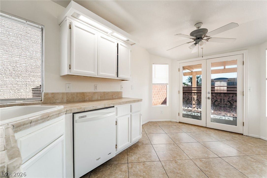 768 Panhandle Drive, Henderson, NV 89014 Tiled flooring and French doors leading outside define this sunlit kitchen eating area.