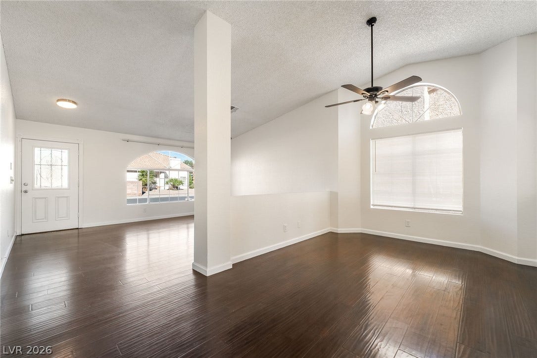 768 Panhandle Drive, Henderson, NV 89014 Gleaming hardwood floors and vaulted ceilings elevate this open interior space.