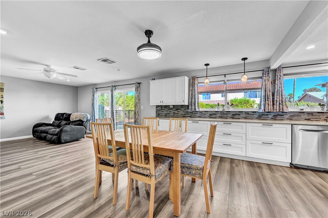 342 Fuente Drive, Henderson, NV 89014 An open floorplan seamlessly connects the dining space and kitchen over durable wood-look flooring.