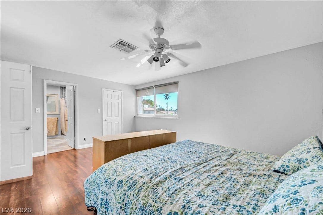 342 Fuente Drive, Henderson, NV 89014 Rich hardwood flooring pairs beautifully with smooth, neutral walls and bright natural light.