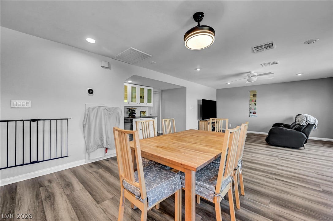 342 Fuente Drive, Henderson, NV 89014 Smooth wood-look flooring anchors this open dining space and adjoining living area.