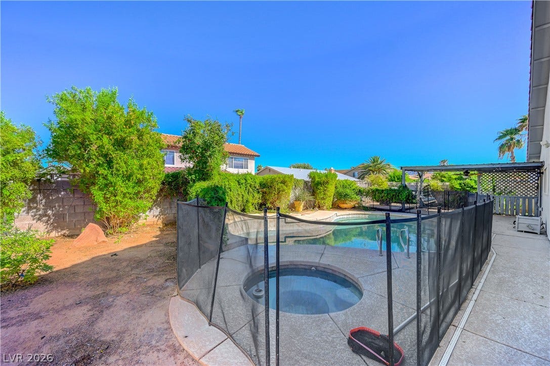 342 Fuente Drive, Henderson, NV 89014 A fenced swimming pool and integrated spa highlight this private backyard setting.