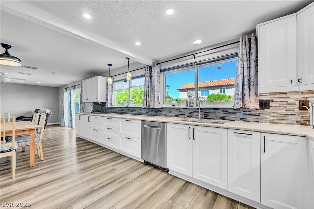 342 Fuente Drive, Henderson, NV 89014 Plentiful counter space and recessed lighting define this modern, open culinary space.