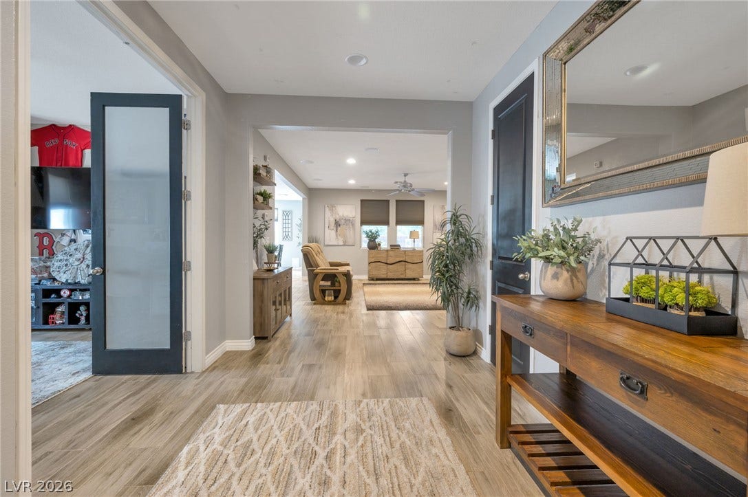 5652 Portage Lake Court, Las Vegas, NV 89130 Step into a generously proportioned entry and open living space featuring wood-look tile flooring.