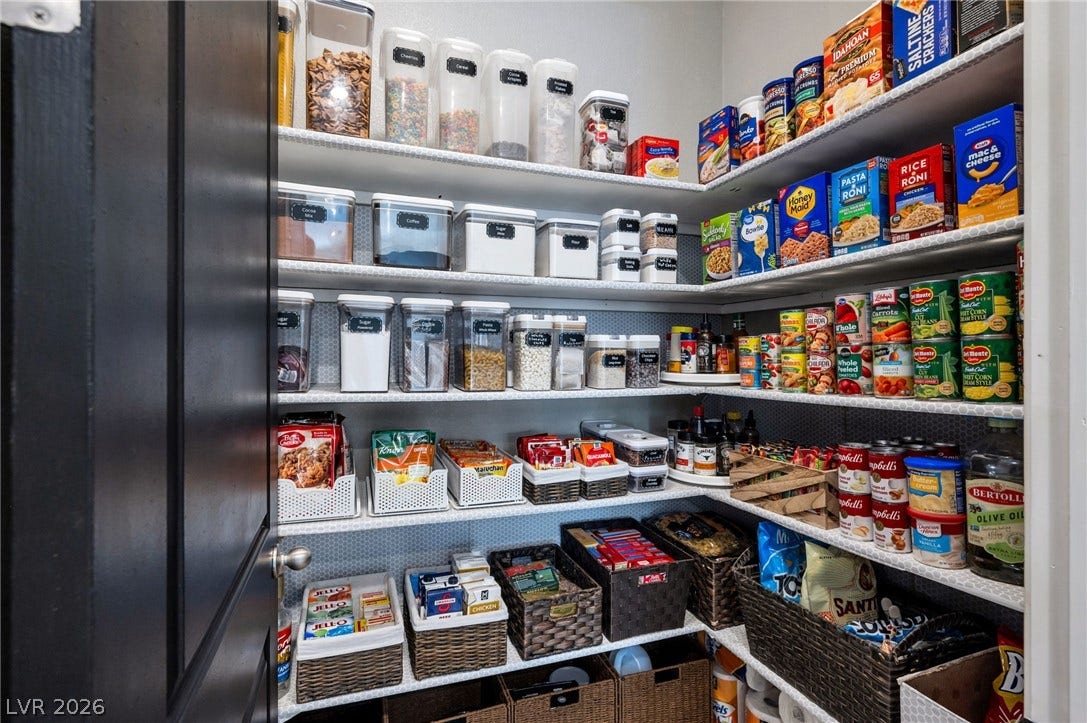 5652 Portage Lake Court, Las Vegas, NV 89130 Well-organized pantry features extensive shelving, providing ample storage for culinary essentials.