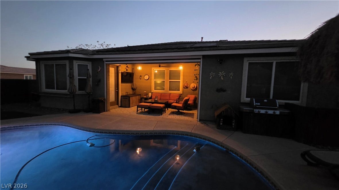 5652 Portage Lake Court, Las Vegas, NV 89130 An inviting backyard oasis offers a sparkling pool and a covered enclosed patio with motorized screen for year-round enjoyment. Installed in August 2020.