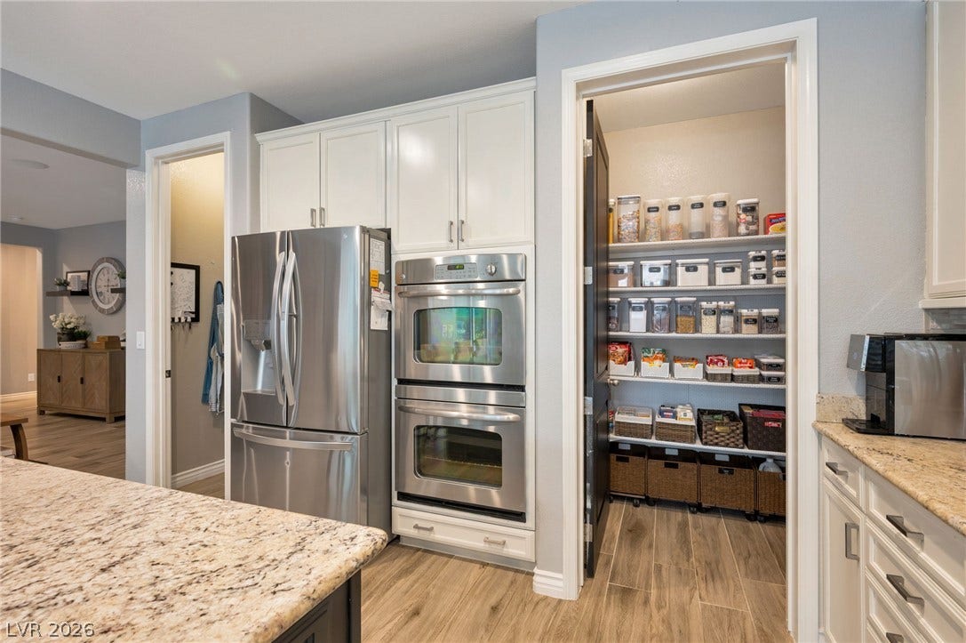 5652 Portage Lake Court, Las Vegas, NV 89130 Culinary delights await in this gourmet kitchen featuring granite counters and state-of-the-art stainless steel appliances.