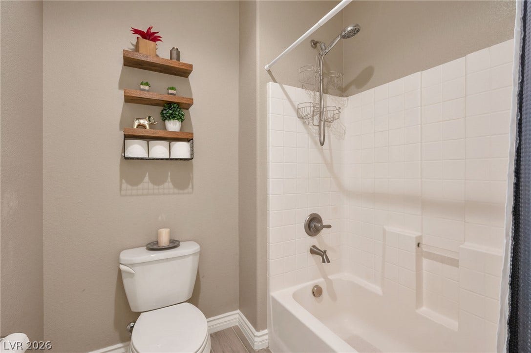 5652 Portage Lake Court, Las Vegas, NV 89130 Functional full bathroom with shower and tub combination, offering practical comfort.