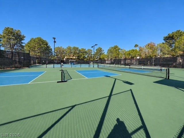 Professional-grade outdoor courts are ready for active matches under clear blue skies.