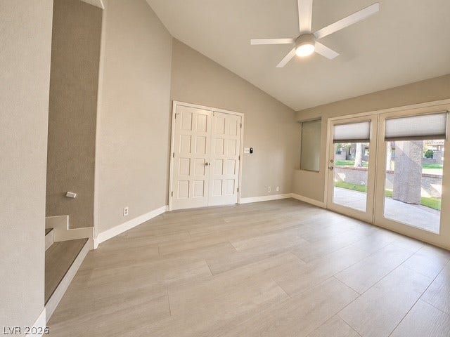 Angled ceilings and durable wood-look flooring enhance this versatile living space.