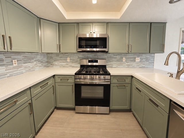 Gleaming stone countertops and modern cabinetry create a functional, stylish kitchen workspace.