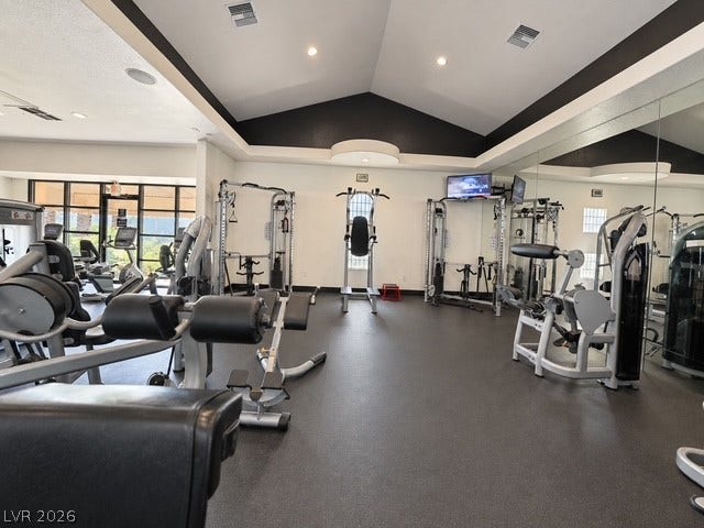 A vaulted ceiling and recessed lighting crown this modern home fitness center.