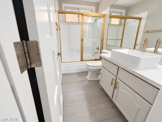 A modern vessel sink and clean tile flooring elevate this updated secondary bathroom.
