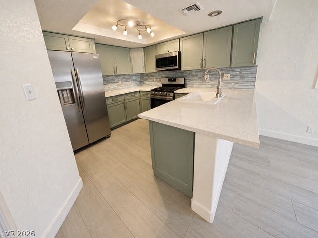 Gleaming stone countertops and modern cabinetry define this carefully updated workspace.