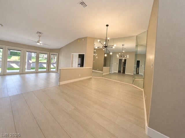 Gleaming tile floors and vaulted ceilings elevate this open interior layout.