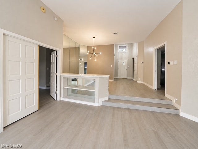Multi-level flooring and high ceilings define this versatile open living space.