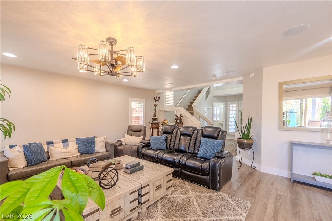 6007 Sonoma Station Avenue, Las Vegas, NV 89139 Gleaming wood floors run through this airy living room with recessed lighting and built-in niches.