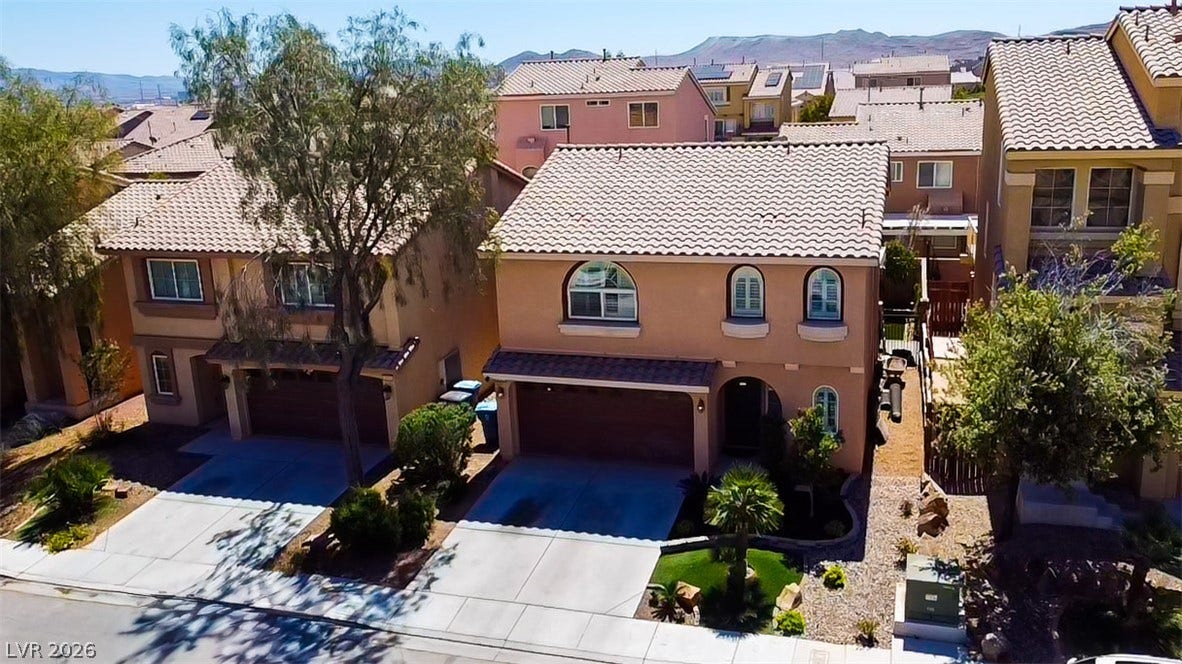 6007 Sonoma Station Avenue, Las Vegas, NV 89139 Spanish tile roofs and arched windows define the exterior of these multi-level homes.