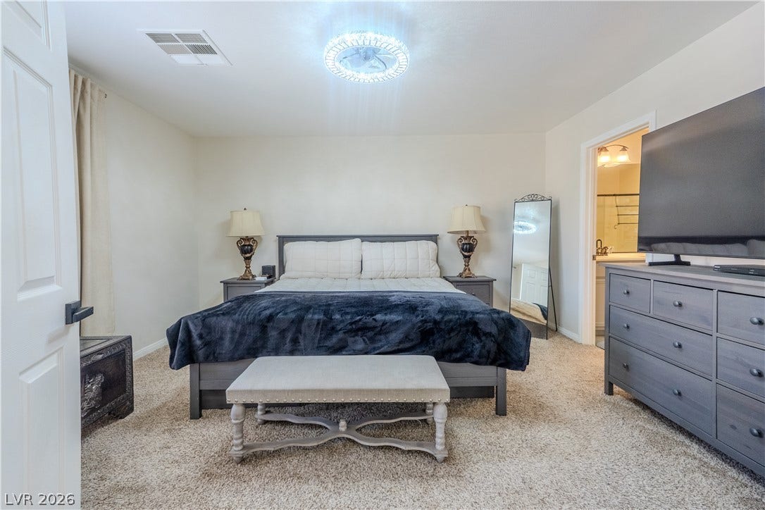 6007 Sonoma Station Avenue, Las Vegas, NV 89139 Plush wall-to-wall carpeting and neutral walls define this comfortable bedroom suite.